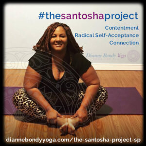 Dianne sits in baddha konasana on a yoga mat.