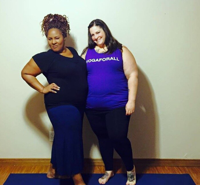 Dianne Bondy and Amber Karnes pose on the yoga mat during Yoga For All filming.